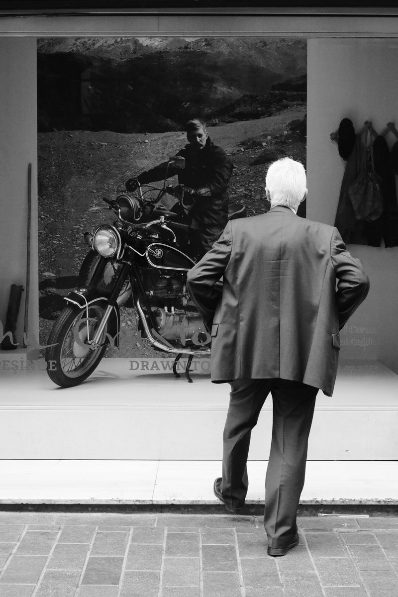 Man looking at the shop window. Taksim.