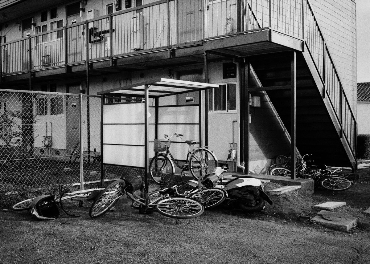 Bicycles under the outside stairs.