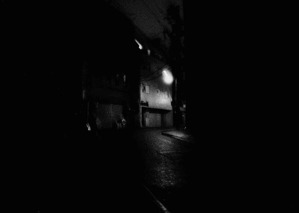 One light in a dark street.